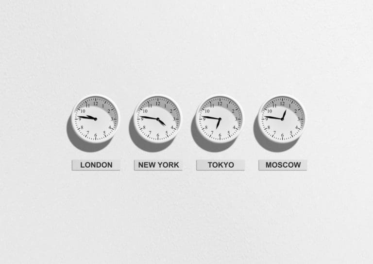 4 clocks showing time in various timezones
