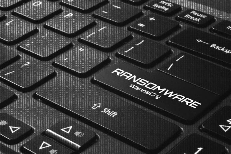 computer keyboard with one key marked ransomware wannacry